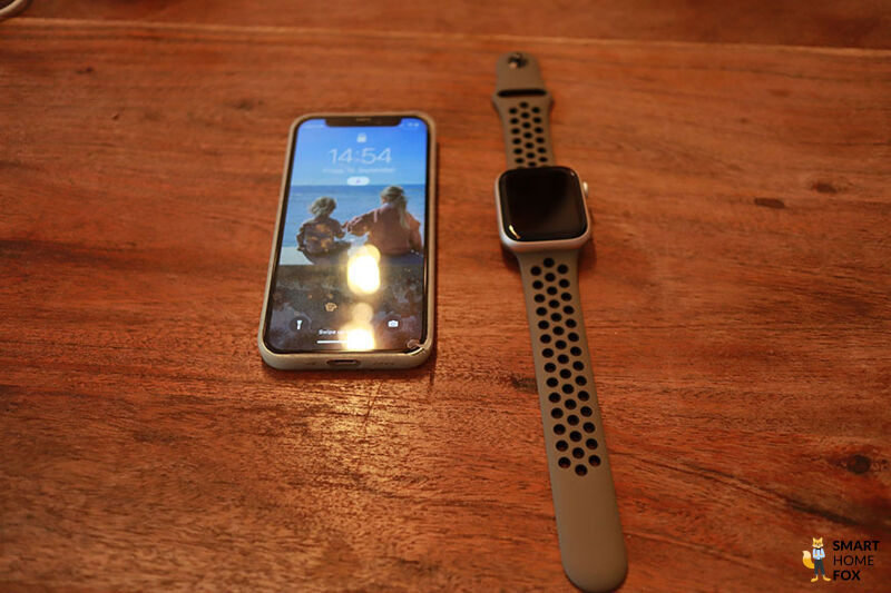 You can see the Apple Watch 8 next to an iPhone.